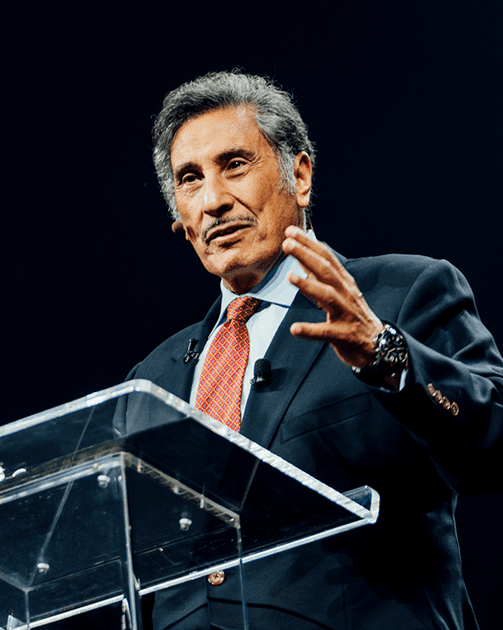 close up of Dr. Youssef gesturing and speaking at a podium