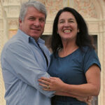 Older couple in an embrace smiling