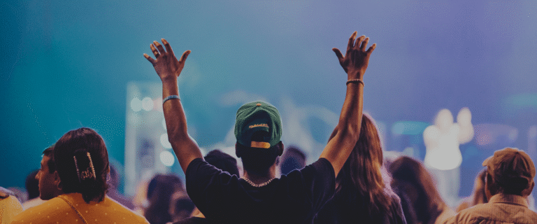 Man raising his hands in the sky