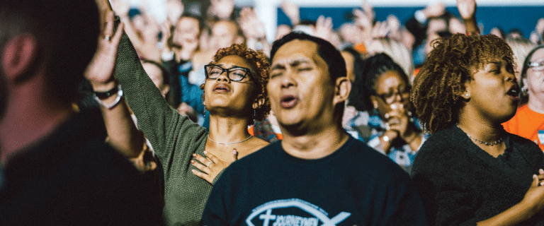 A crowd singing and praising