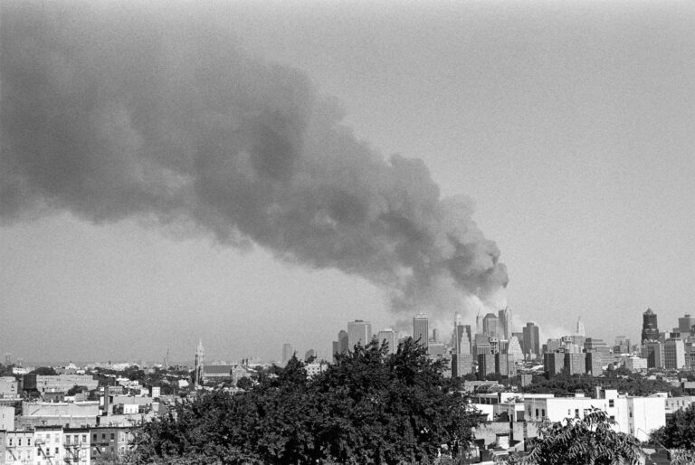 September 11 2001 world trade center showing smoke billowing